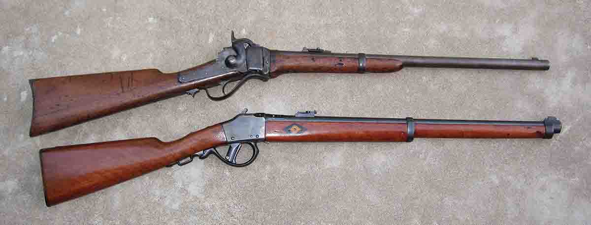 The Mle 1871/83 Comblain (bottom) and .50-70 Sharps carbine (top).